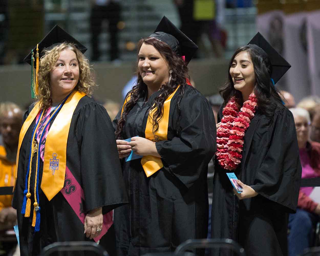 Three women at Chemeketa graduation ceremony